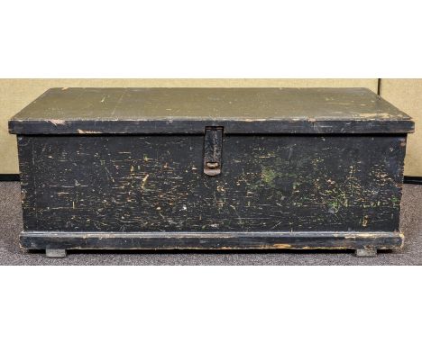 A large early 20th century chest/trunk with ebonised hinged top revealing trays