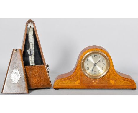 An Edwardian small mahogany and inlay Napoleon hat clock along with a metronome. 
