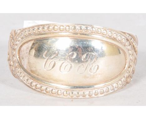 A silver napkin ring