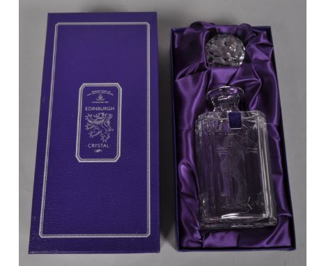 An Edinburgh crystal decanter etched with a golfer in fitted case