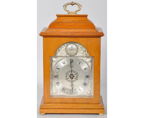 A Queens Jubilee mahogany mantel clock with silvered face, brass handle and bun feet. 