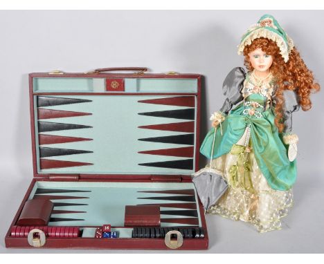 A porcelain doll and a backgammon set