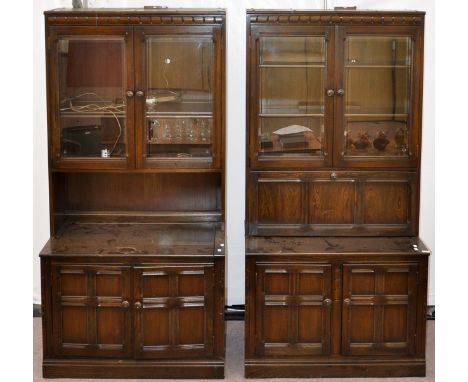A pair of Ercol Old Colonial cabinets, width 98cm, 196cm high