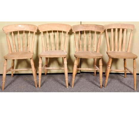 A set of three pine stick back dining chairs along with another. Measures; 85cm high. 