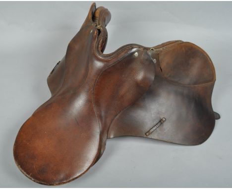 A brown leather saddle general purpose saddle from D ring to D ring 23cm the seat 42cm long