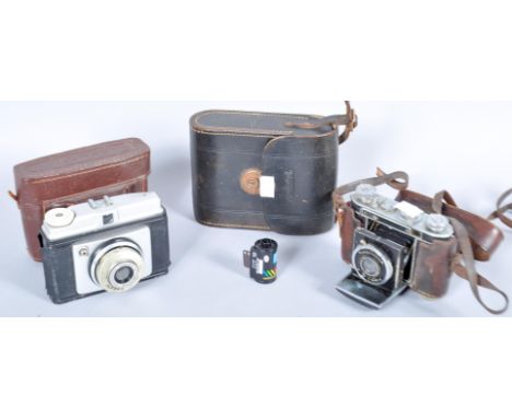 An Ilford cased camera, Certo Dollino cased camera and a case set of binoculars. 