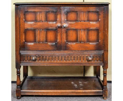 A 20th Century Ercol colonial cupboard over drawer. Measure; 91cm x 91cm x 41cm.