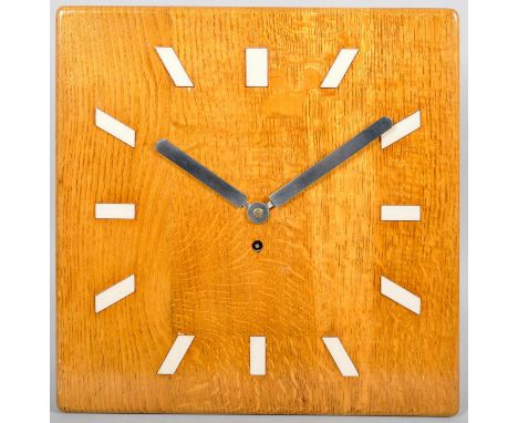 A 20th Century golden oak cased eight day wall clock with squared face. 