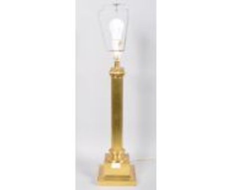 A large brass Corinthian column electric lamp base with harp raised on squared flared base. Measures; 53cm 