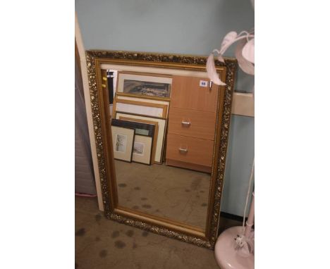 Gilt frame mirror and a lamp