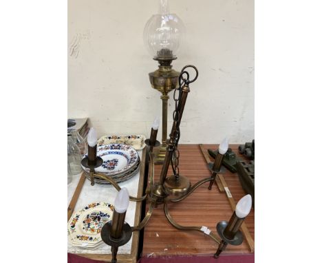 A brass oil lamp together with a brass chandelier and assorted pottery plates etc 