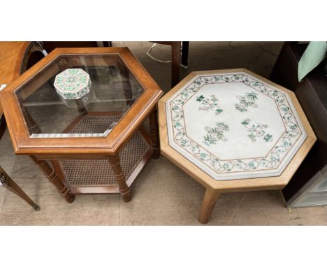 A white marble octagonal Pietra Dura table top inlaid with mother of pearl, malachite and other hardstones, inset into an oak