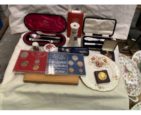 A silver spoon and fork christening set together with coins, commemoratives, crested wares etc