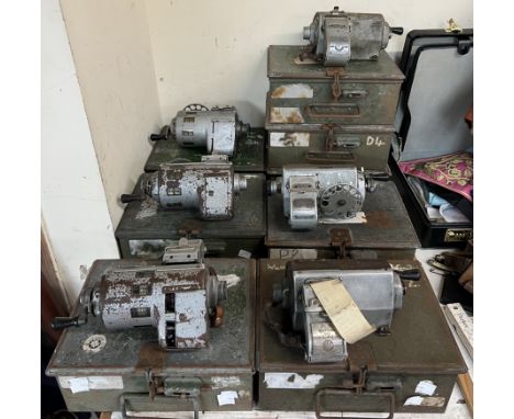 A Plessey ticket machine together with a large collection of ticket machines in their original cases