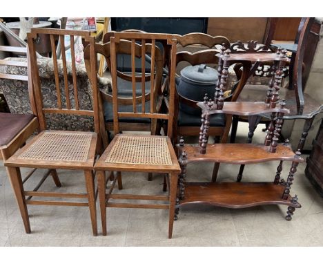 A pair of bedroom chairs with a stick back and a caned seat on square tapering legs together with a four tier whatnot