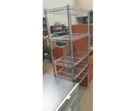 A pair of modern bedroom chests together with a chrome shelf unit