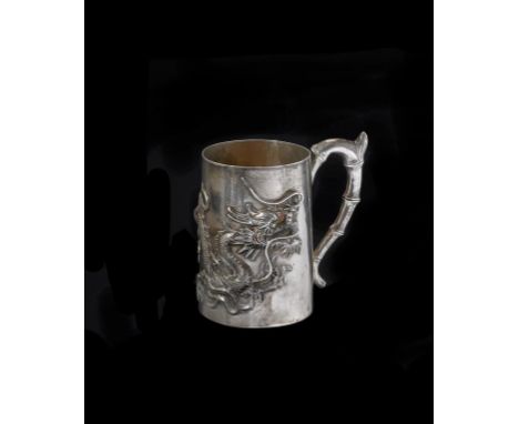 Chinese silver export child’s mug with dragon motif and bamboo handle.  Weight 126g.