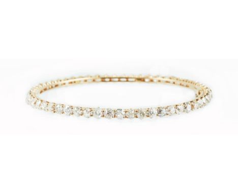 A pink gold and diamond bangle. Diamond 57pcs / 10.70ct. Total weight 11.68g.