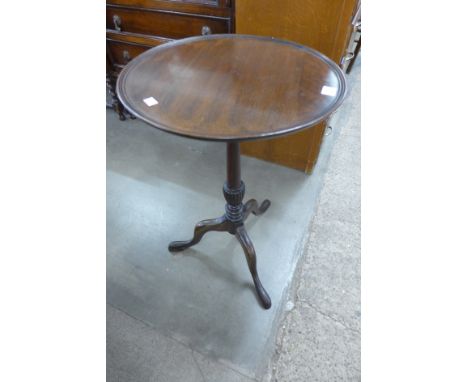 A mahogany tripod wine table