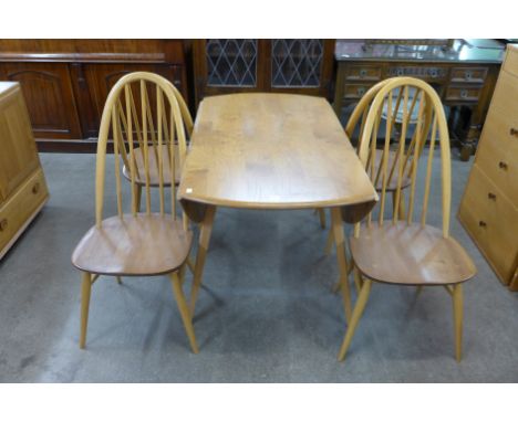 An Ercol drop leaf dining table and four chairs