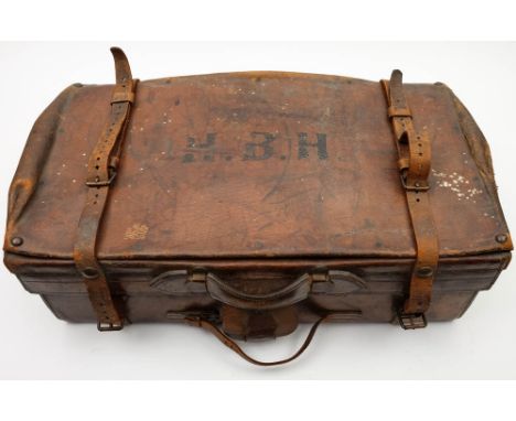 A brown leather travelling suitcase by The Army & Navy Co-operative, London:, initialled 'HGH' to top, with fitted interior a