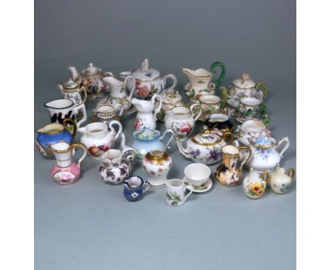 A mixed group of miniature porcelain jugs, bowls, vase and some tea wares: including florally encrusted, Continental, Hammers