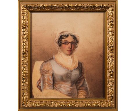 English School early 19th Century-A portrait of a young lady:, half-length seated, with blue eyes, wearing a white lace bonne