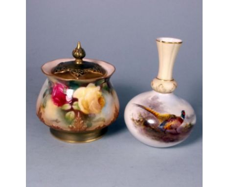 A Royal Worcester porcelain pot pourri jar and cover and a vase: the former of squat form with pierced domed cover and raised