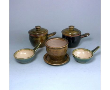 A group of studio pottery: comprising a pair of Sid Tustin stoneware one handled bowls and covers under a yellow speckled ten