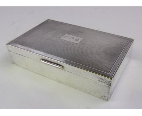 An Elizabeth II silver cigarette box, maker Garrard & Co Ltd,  London 1956: initialled with engine turned decoration and wood