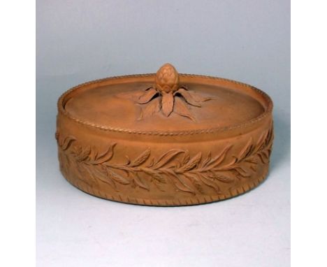 A cane ware pie dish and cover: of oval form the exterior of the dish moulded with an encircling band of wheat beneath a crim