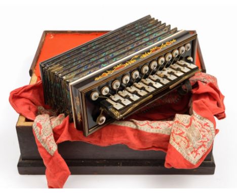 A late 19th /early 20th century mahogany inlaid and mother of pearl decorated melodium:, unsigned, embossed and painted silve