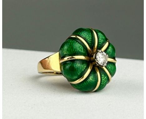 A FABERGE STYLE STATEMENT RING, GREEN ENAMEL AND GOLD WITH A CENTRAL DIAMOND. By repute custom made by Garrard and Co. Weight