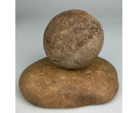 A NEOLITHIC QUERN STONE AND BALL FROM SUFFOLK,Together 11cm H x 15cm WLarge example of a finely shaped Neolithic quern and ba