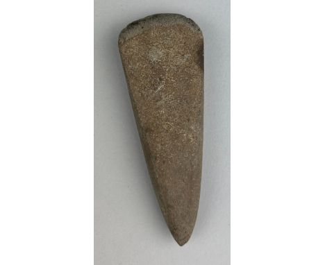 A NEOLITHIC AXE HEAD FROM SUFFOLK,12.5cm x 4.5cmA large, finely worked and polished stone Neolithic axe head from Suffolk, En