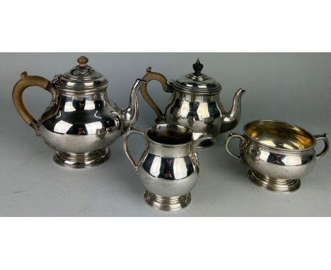 A LONDON SILVER TEA SERVICE MOSTLY BY RICHARD COMYNS, Comprising a tea pot, milk pail and sugar bowl along with another simil