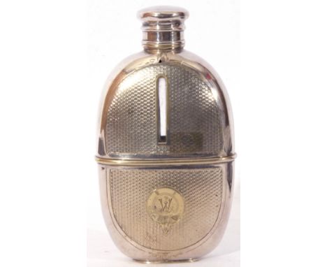 Late 19th/early 20th century hip flask of oval form, silver plated mounts, with a clear glass liner and screw on lid, no make