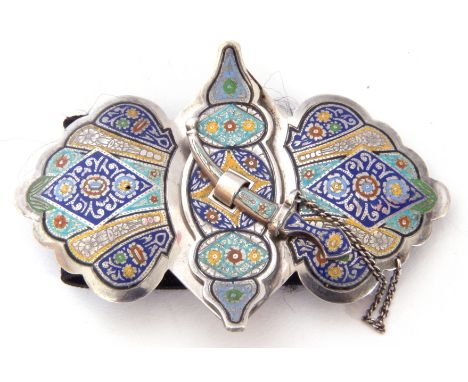 Unusual pair of Russian white metal and enamel belt buckles of stylised foliate form fitted with a dagger formed fastener on 
