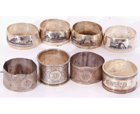 Collection of silver and white metal napkin rings to include pair of Birmingham hallmarked examples with engine turned decora