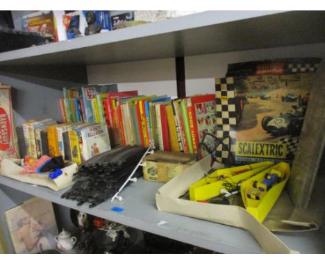 A mixed lot of toys and children's annuals and books to include a Scalextric set, a boxed Barnsbury pirate puppet, a child's 