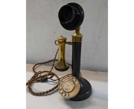 A black painted and brass candlestick telephone Location: 11.2 