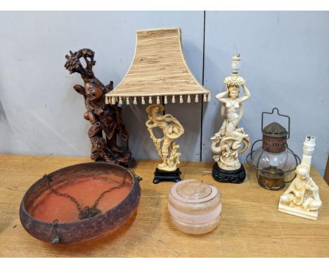 Lamps to include Oriental style resin examples, a Japanese carving of a figure with bone eyes and teeth, and a French style c