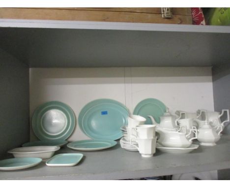 A group of Poole pottery two-tone plates and meat platters, and a Johnson Bros part dinner service Location: 