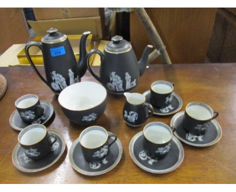 A Victorian F &amp; R Pratt &amp; Co pottery coffee set decorated with classical Roman figures and chariots against a black g