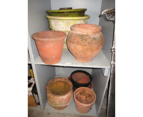 A mixed lot to include various terracotta garden planters and pot, one in a green glaze, a 19th century brass warming pan wit