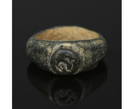 ITEM: Ring depicting a dolphinMATERIAL: BronzeCULTURE: RomanPERIOD: 1st - 3rd Century A.DDIMENSIONS: 24 mm x 20 mmCONDITION: 