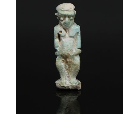 ITEM: Amulet of the God PataikosMATERIAL: FaienceCULTURE: EgyptianPERIOD: Late period, 664 - 332 B.CDIMENSIONS: 47 mm x 15 mm