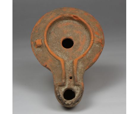 ITEM: Factory oil lamp with makers mark, Type Buchi X aMATERIAL: PotteryCULTURE: RomanPERIOD: 1st - 2nd Century A.DDIMENSIONS