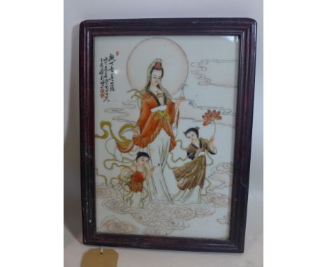 A 20th century Chinese porcelain plaque hand-painted with a female deity and two young children amongst clouds, signed top le