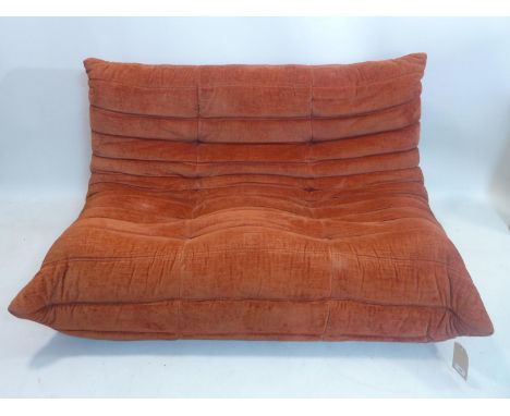 A Ligne Roset Togo sofa, with terracotta coloured upholstery, H.70 W.135 D.100cm 